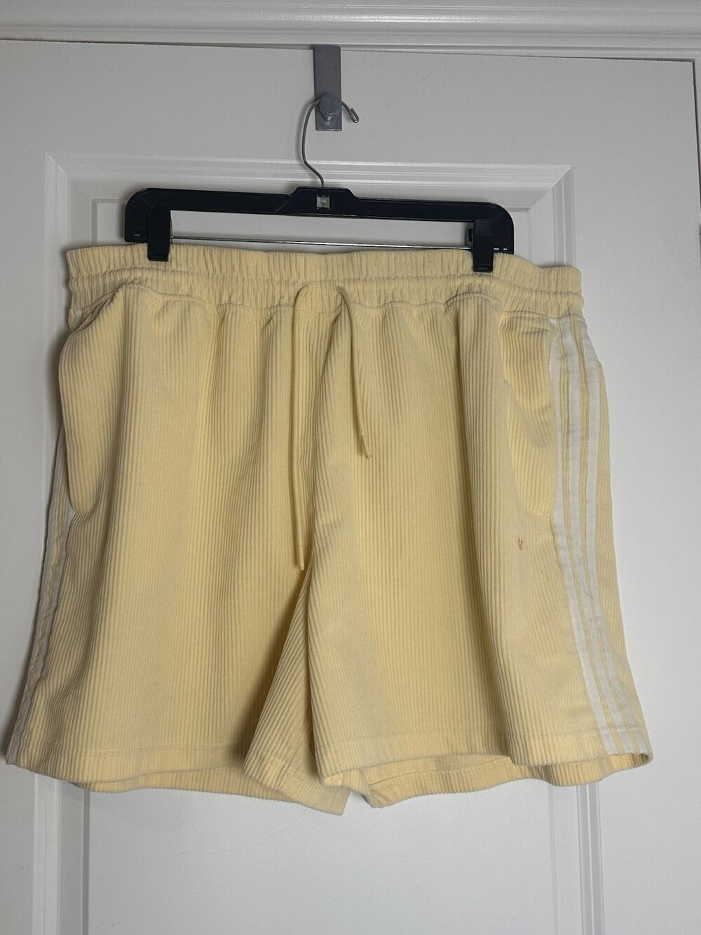 Adidas yellow corduroy shorts with white stripes, size 2XL